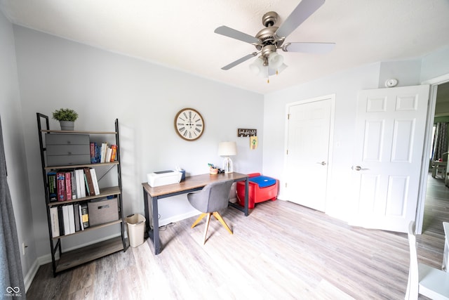 1334 Legacy Ct, Indianapolis, IN 46234 - home office with wood finished floors, a ceiling fan, and baseboards