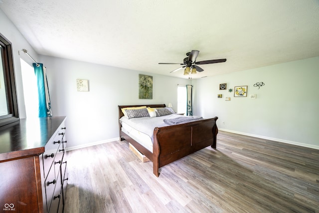 1334 Legacy Ct, Indianapolis, IN 46234 - bedroom with wood finished floors, baseboards, and a ceiling fan