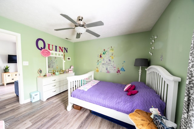 1334 Legacy Ct, Indianapolis, IN 46234 - bedroom featuring light wood-style floors, a ceiling fan, and baseboards