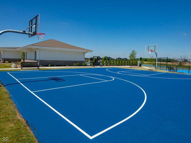 view of basketball court featuring community basketball court and fence