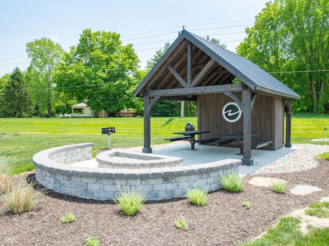 view of home's community with a lawn and a gazebo