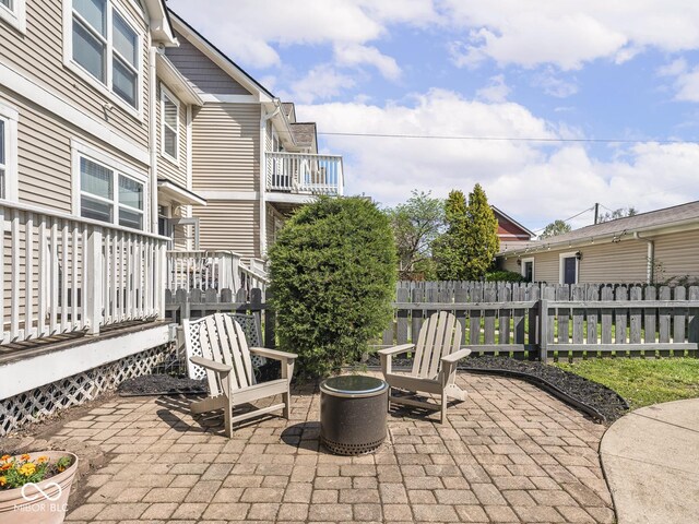 view of patio / terrace featuring fence