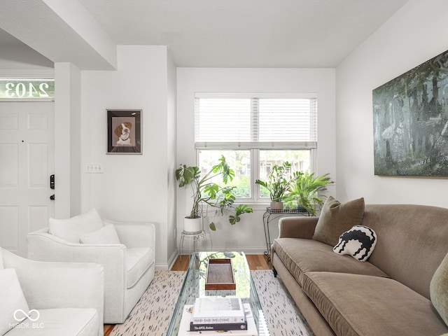 living area with light wood finished floors and baseboards