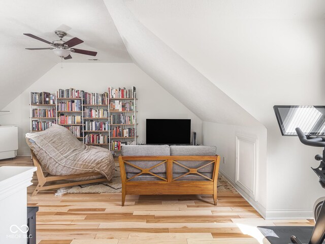 sitting room with wood finished floors, vaulted ceiling, and ceiling fan