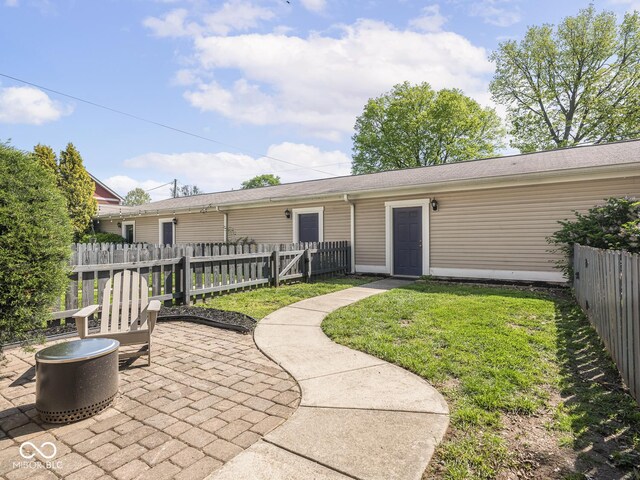 back of property with a patio