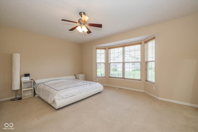 14018 Powder Dr, Carmel, IN 46033 - carpeted bedroom featuring baseboards and a ceiling fan