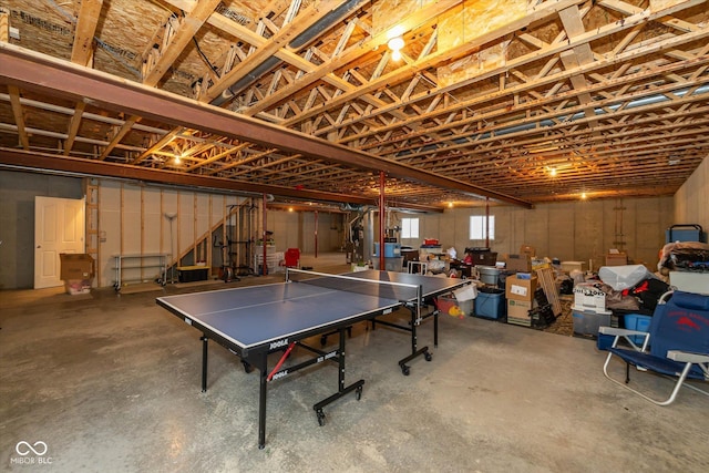 14018 Powder Dr, Carmel, IN 46033 - game room with unfinished concrete flooring