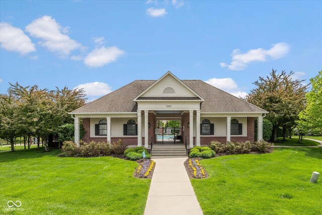 14018 Powder Dr, Carmel, IN 46033 - neoclassical home with covered porch, brick siding, and a front yard