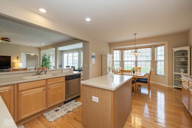 14018 Powder Dr, Carmel, IN 46033 - kitchen with stainless steel dishwasher, light wood-style floors, open floor plan, light countertops, and recessed lighting