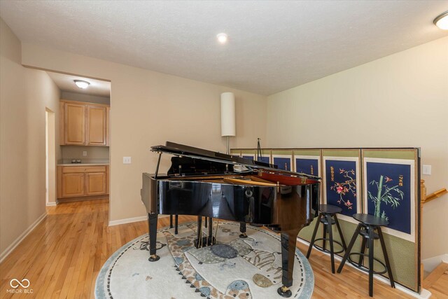 14018 Powder Dr, Carmel, IN 46033 - living area with light wood-type flooring and baseboards