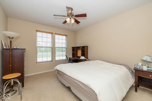 14018 Powder Dr, Carmel, IN 46033 - bedroom featuring light colored carpet, baseboards, and a ceiling fan