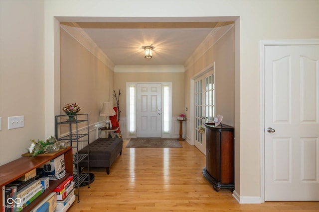 14018 Powder Dr, Carmel, IN 46033 - entrance foyer featuring light wood-type flooring, ornamental molding, and healthy amount of natural light