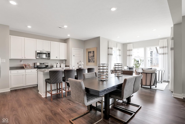 1075 Marston Ln, Avon, IN 46123 - dining room with dark wood-style floors, recessed lighting, and baseboards