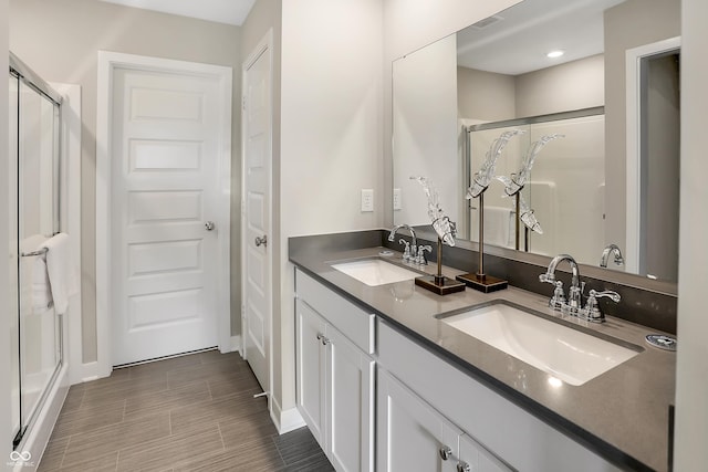 1075 Marston Ln, Avon, IN 46123 - bathroom featuring a stall shower, double vanity, and baseboards