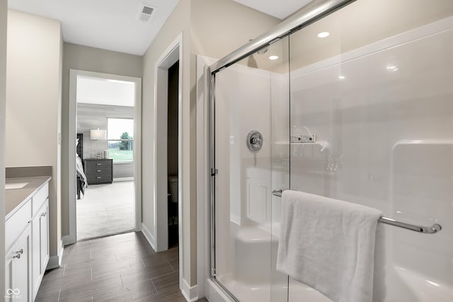 1075 Marston Ln, Avon, IN 46123 - full bathroom featuring a stall shower, wood finished floors, and vanity