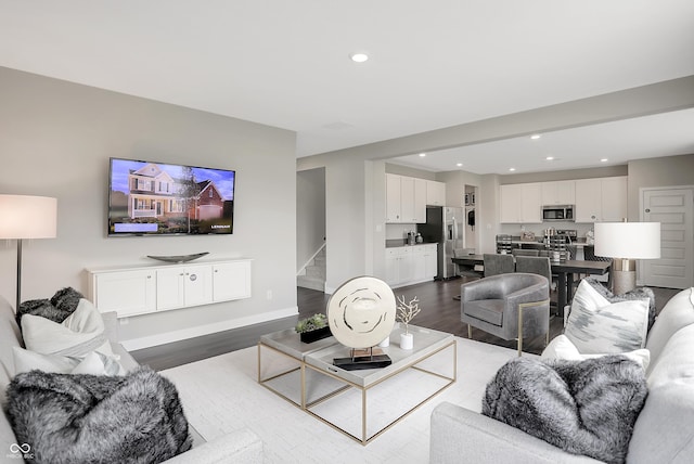 1075 Marston Ln, Avon, IN 46123 - living area featuring dark wood-style flooring, stairs, recessed lighting, and baseboards
