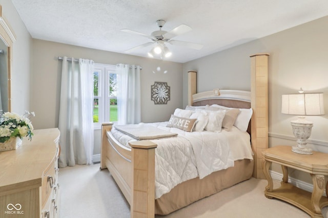 4732 Ferguson Rd, Indianapolis, IN 46239 - bedroom with light colored carpet and a ceiling fan