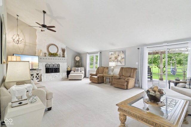 4732 Ferguson Rd, Indianapolis, IN 46239 - carpeted living area with lofted ceiling, ceiling fan, a fireplace, and a chandelier