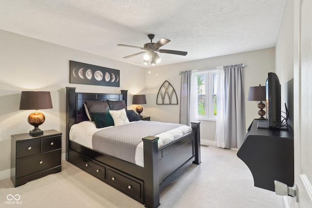 4732 Ferguson Rd, Indianapolis, IN 46239 - carpeted bedroom with baseboards, a textured ceiling, and a ceiling fan