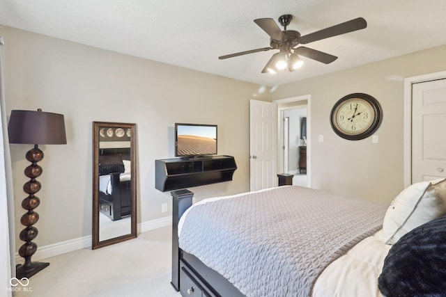 4732 Ferguson Rd, Indianapolis, IN 46239 - bedroom with light carpet, a ceiling fan, and baseboards