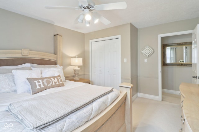 4732 Ferguson Rd, Indianapolis, IN 46239 - bedroom with light colored carpet, a closet, baseboards, and ceiling fan