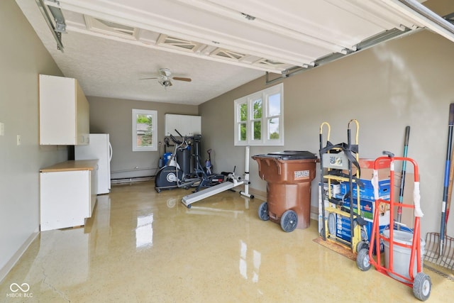 4732 Ferguson Rd, Indianapolis, IN 46239 - garage with ceiling fan, baseboards, and freestanding refrigerator