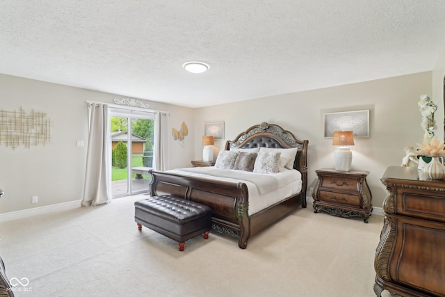 4732 Ferguson Rd, Indianapolis, IN 46239 - bedroom featuring access to outside, light carpet, a textured ceiling, and baseboards