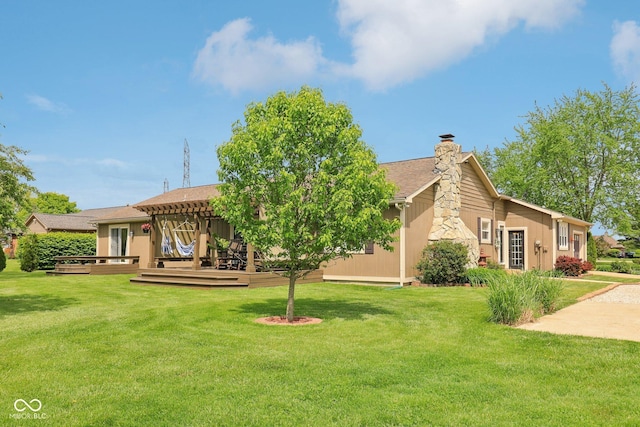 4732 Ferguson Rd, Indianapolis, IN 46239 - back of property featuring a chimney, a yard, and a wooden deck