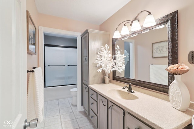 4732 Ferguson Rd, Indianapolis, IN 46239 - bathroom featuring vanity, tile patterned flooring, toilet, and enclosed tub / shower combo