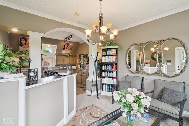 4732 Ferguson Rd, Indianapolis, IN 46239 - dining area featuring a chandelier, arched walkways, light colored carpet, crown molding, and baseboards
