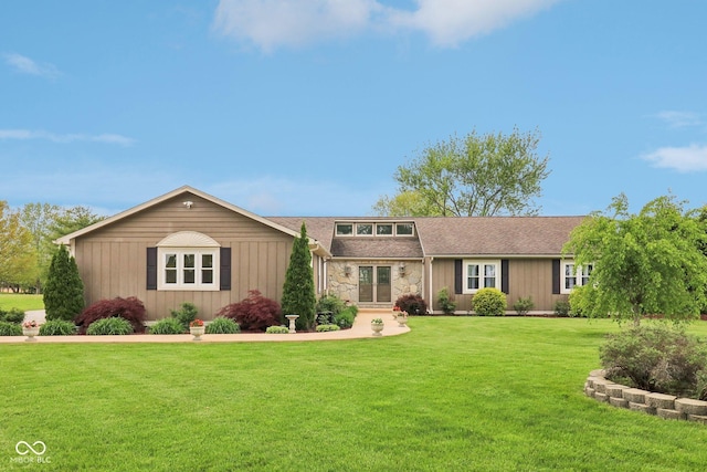 4732 Ferguson Rd, Indianapolis, IN 46239 - view of front facade with a front yard, stone siding, board and batten siding, and roof with shingles