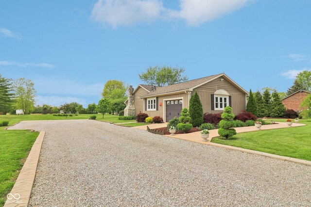 4732 Ferguson Rd, Indianapolis, IN 46239 - ranch-style home with a garage, gravel driveway, a front yard, a chimney, and roof with shingles