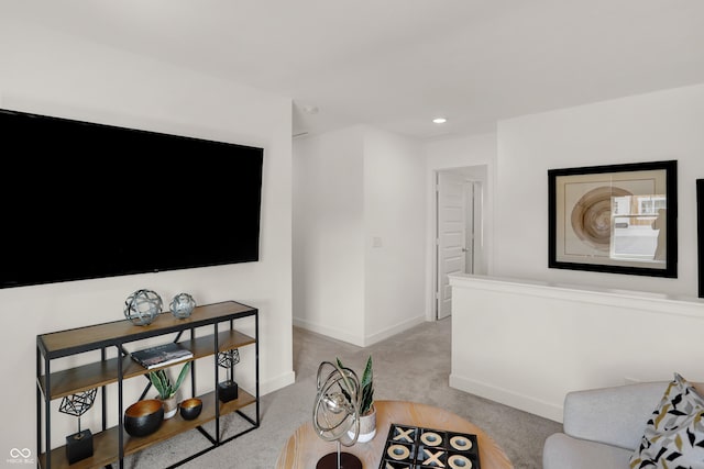 carpeted living room featuring baseboards and recessed lighting