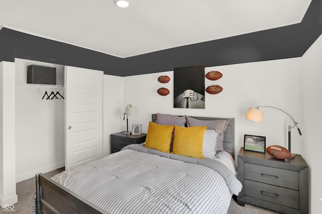 bedroom featuring carpet floors and baseboards