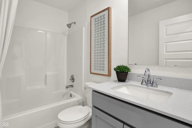 bathroom with toilet, vanity, and shower / washtub combination