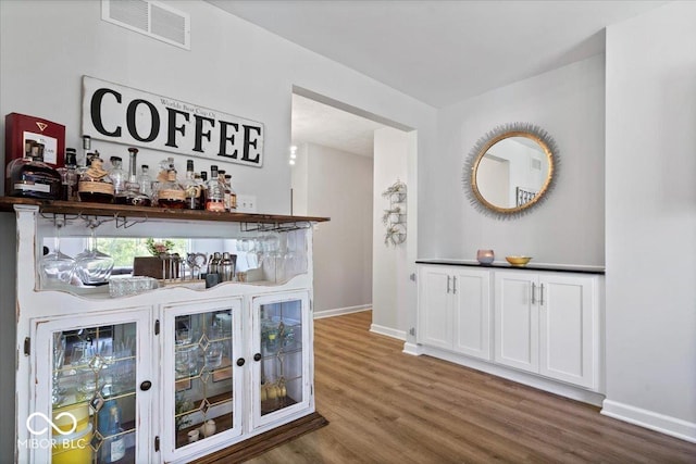10444 Collingswood Ln, Fishers, IN 46037 - indoor dry bar featuring wood finished floors and baseboards