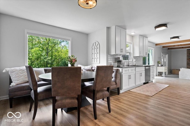 10444 Collingswood Ln, Fishers, IN 46037 - dining room with light wood finished floors, baseboards, and beamed ceiling