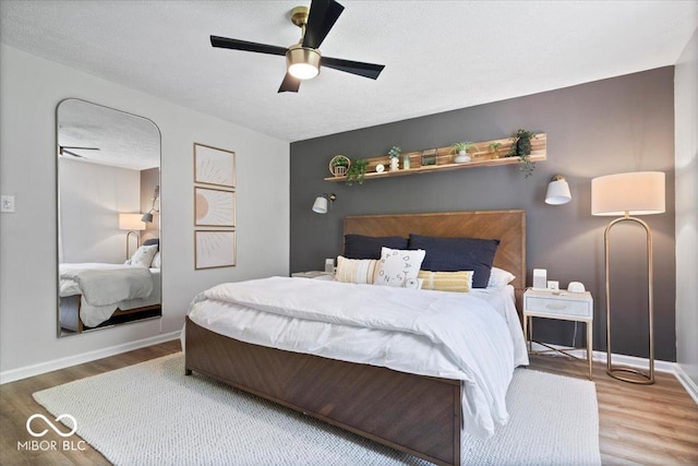 10444 Collingswood Ln, Fishers, IN 46037 - bedroom featuring wood finished floors, baseboards, and a ceiling fan