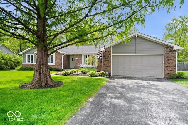 10444 Collingswood Ln, Fishers, IN 46037 - ranch-style house featuring brick siding, driveway, a garage, and a front yard