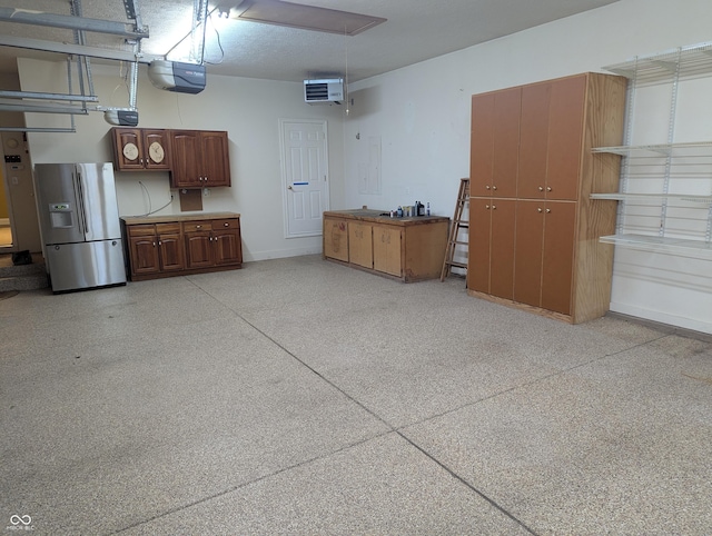 9640 Bramblewood Way, Carmel, IN 46032 - garage with refrigerator with ice dispenser, a garage door opener, a heating unit, and baseboards