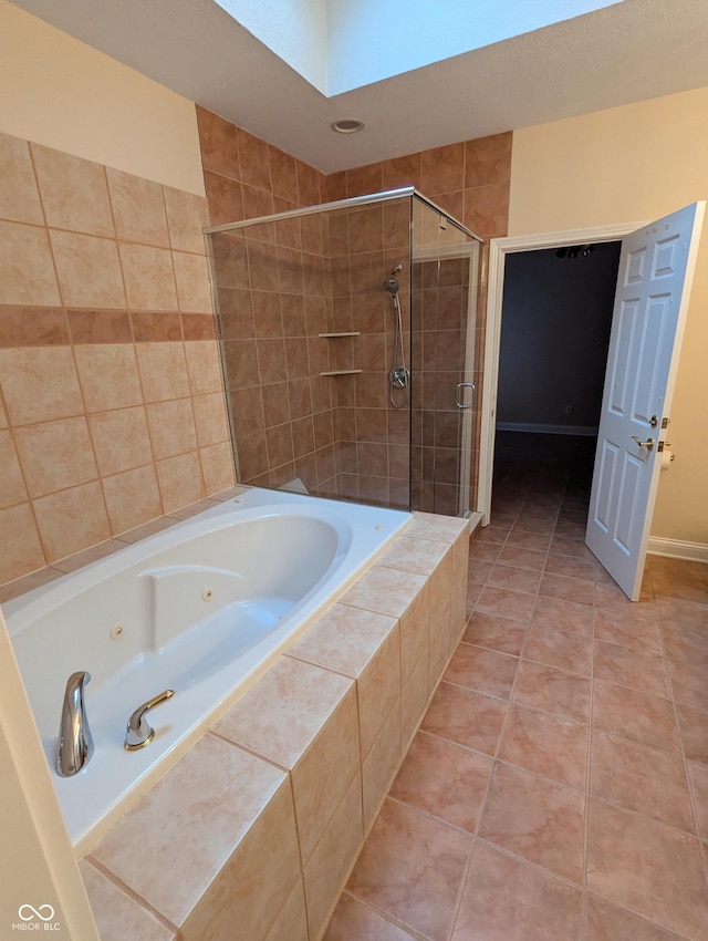 9640 Bramblewood Way, Carmel, IN 46032 - full bathroom with a tub with jets, a shower stall, tile patterned flooring, and a skylight