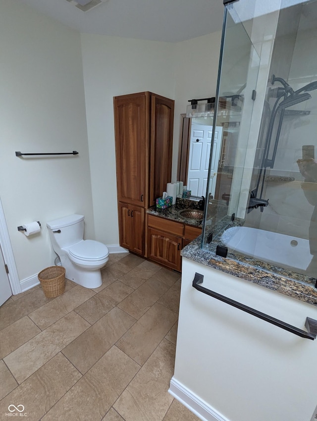 9640 Bramblewood Way, Carmel, IN 46032 - full bath featuring vanity, a tile shower, toilet, and baseboards
