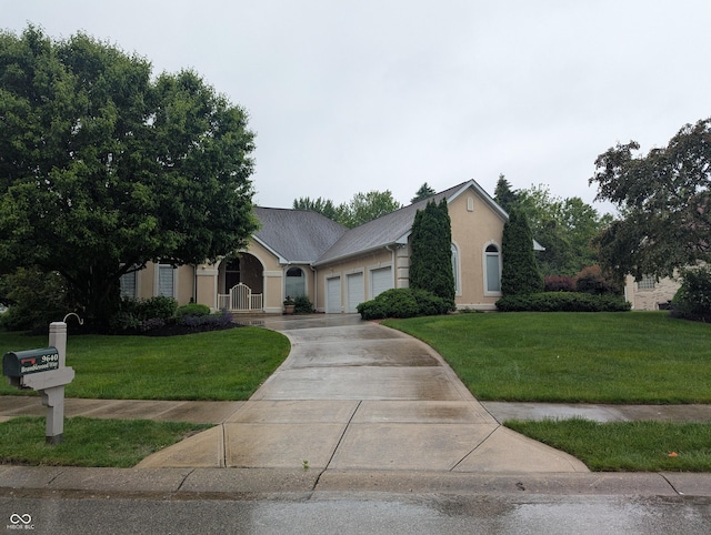 9640 Bramblewood Way, Carmel, IN 46032 - view of front of property with a garage, a front lawn, concrete driveway, and stucco siding