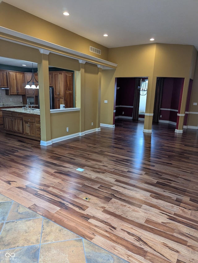 9640 Bramblewood Way, Carmel, IN 46032 - unfurnished living room with recessed lighting, dark wood-type flooring, a sink, and baseboards