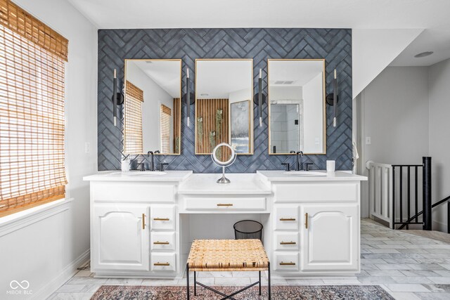 4956 Waterside Cir, Carmel, IN 46033 - full bathroom with double vanity, baseboards, and an accent wall