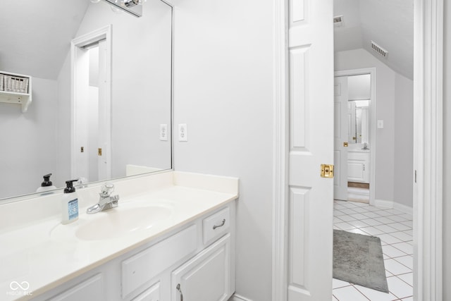 4956 Waterside Cir, Carmel, IN 46033 - bathroom with lofted ceiling, vanity, and tile patterned floors