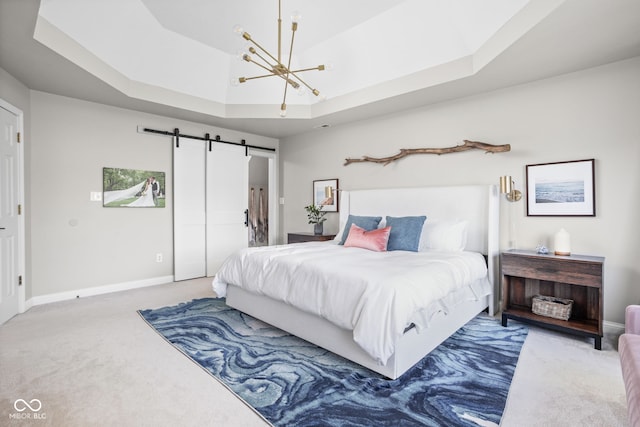 4956 Waterside Cir, Carmel, IN 46033 - bedroom with carpet, a chandelier, baseboards, and a barn door