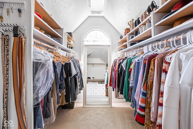 4956 Waterside Cir, Carmel, IN 46033 - spacious closet featuring lofted ceiling and carpet flooring