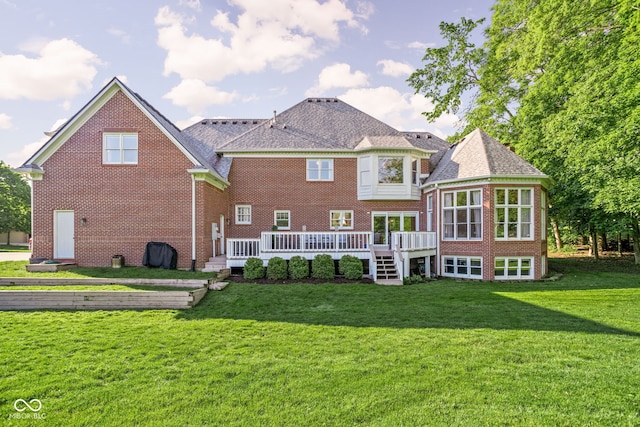 4956 Waterside Cir, Carmel, IN 46033 - back of house featuring brick siding, a deck, and a yard