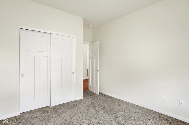 49 Manchester Dr, Trafalgar, IN 46181 - unfurnished bedroom with carpet, baseboards, and a closet
